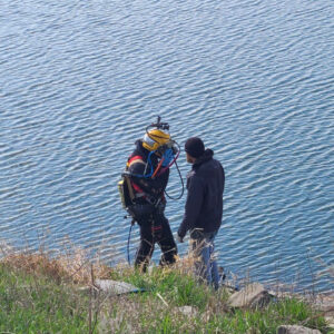 Divers enter West Lake to evaluate the lower intake for Osceola Water Works